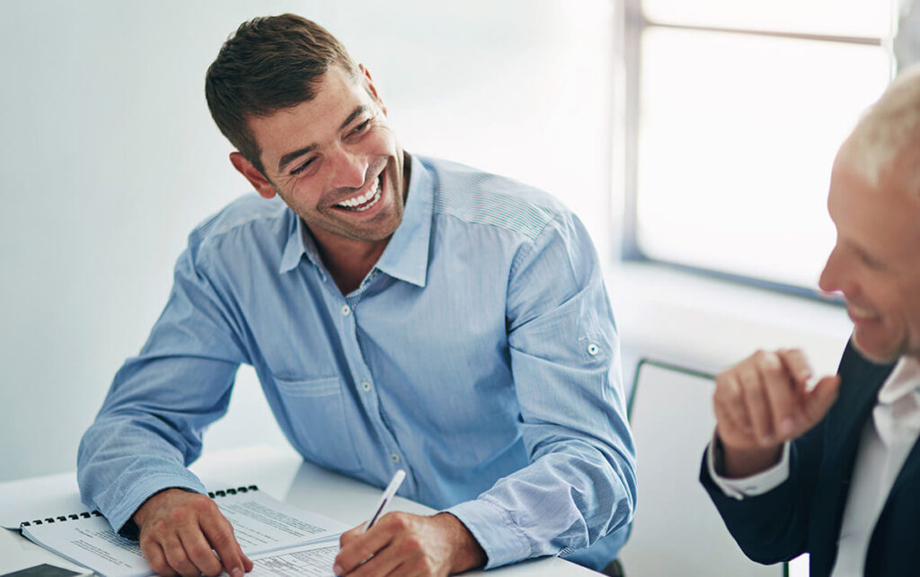 Business professionals reviewing documents in an office meeting